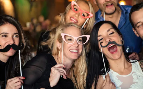 Photo booth guests at a wedding reception