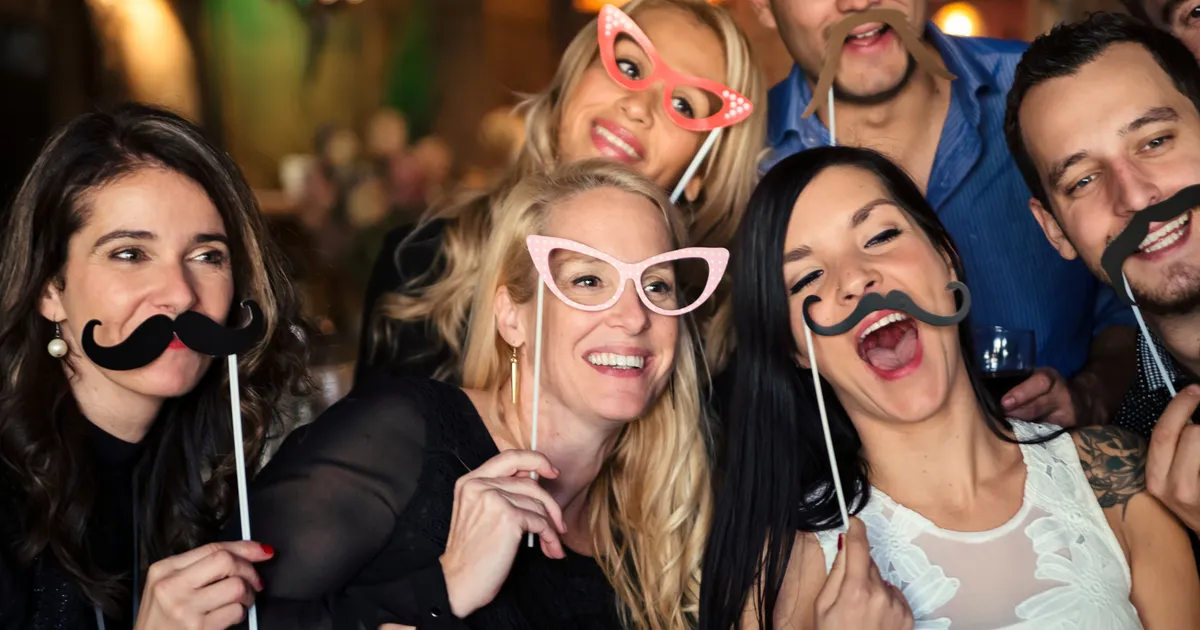 Photo booth guests at a wedding reception