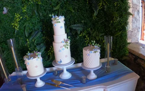 Three wedding cakes on a table