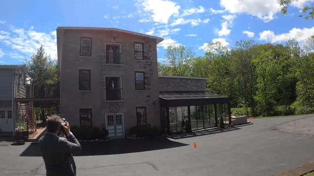 Courtney and Michael on separate balconies of The Sinclair for their first look