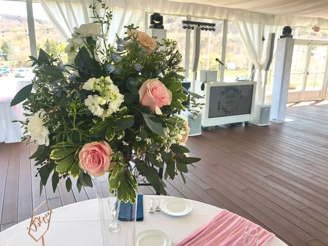 Floral arrangements at Rachael and Tom’s Greek Peak Mountain Resort wedding
