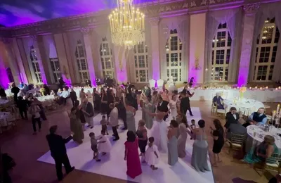 Wedding reception venue with colored uplighting