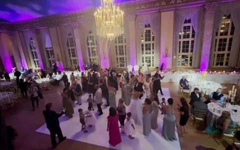 Wedding reception venue with colored uplighting