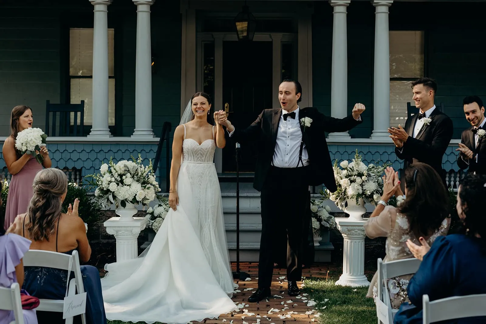 Summer and Nick at the altar with guests at their Sherwood Inn wedding ceremony