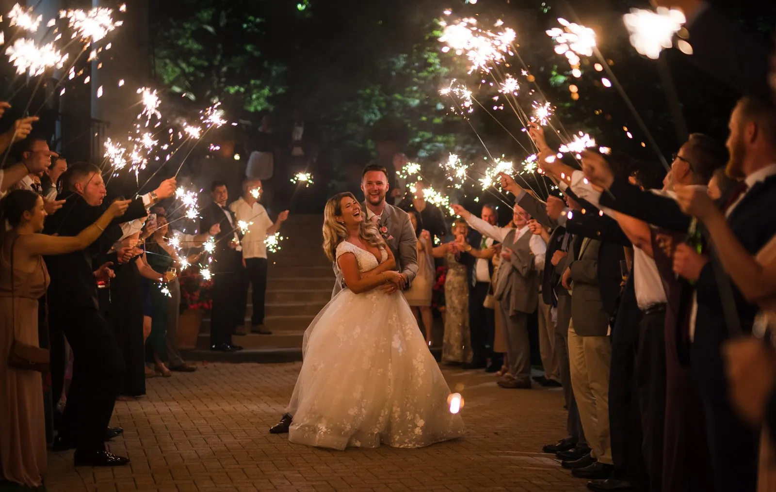 Melissa and Jeremy celebrating at their Otesaga Resort wedding reception