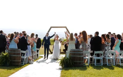 Mac and Abby at their wedding at Wagner Vineyards Estate Winery