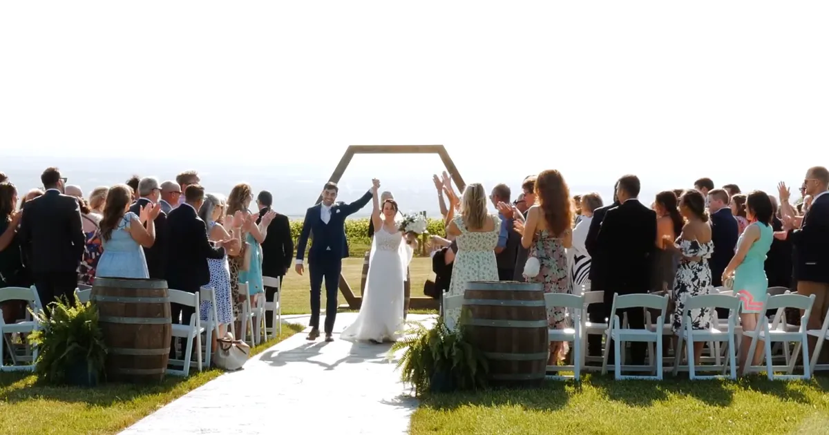 Mac and Abby at their wedding at Wagner Vineyards Estate Winery