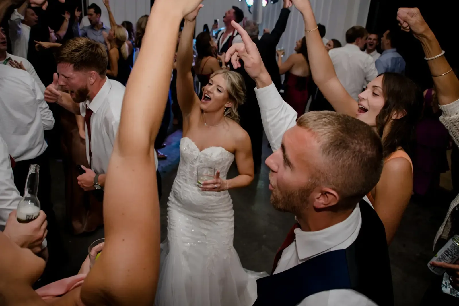 Guests dancing at Emily and Troy’s wedding reception at The Lookout at Hope Lake