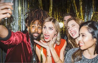 DIY photo booth setup with a tripod and props