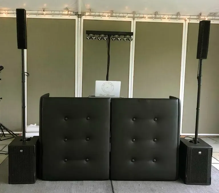 black plush facade on a dj booth at a wedding celebration