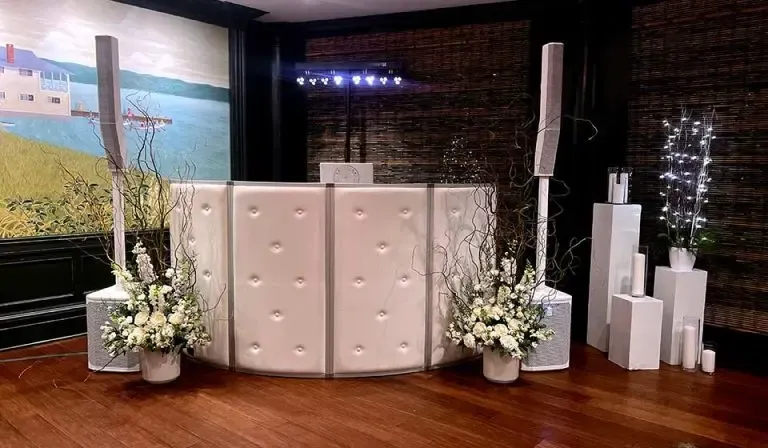 light curved plush facade on a dj booth at a wedding