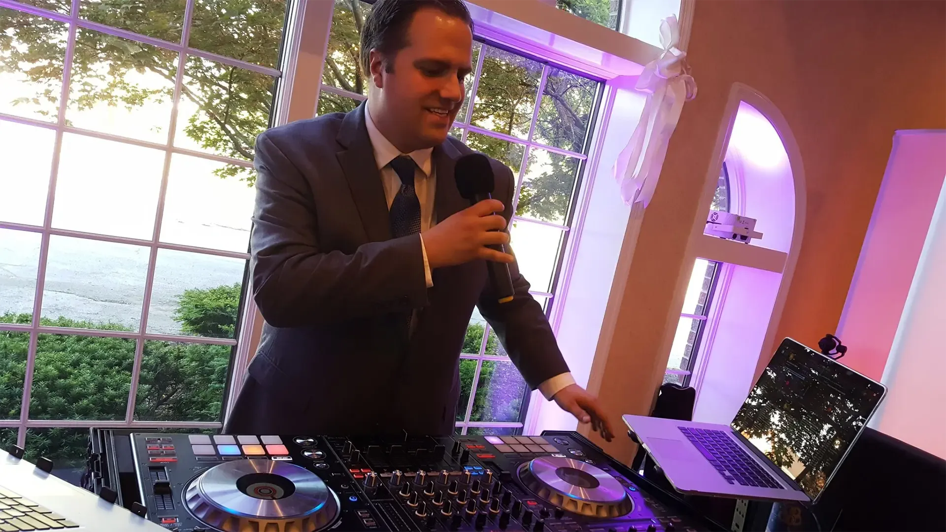 Paul Manzari at a wedding working at his DJ booth