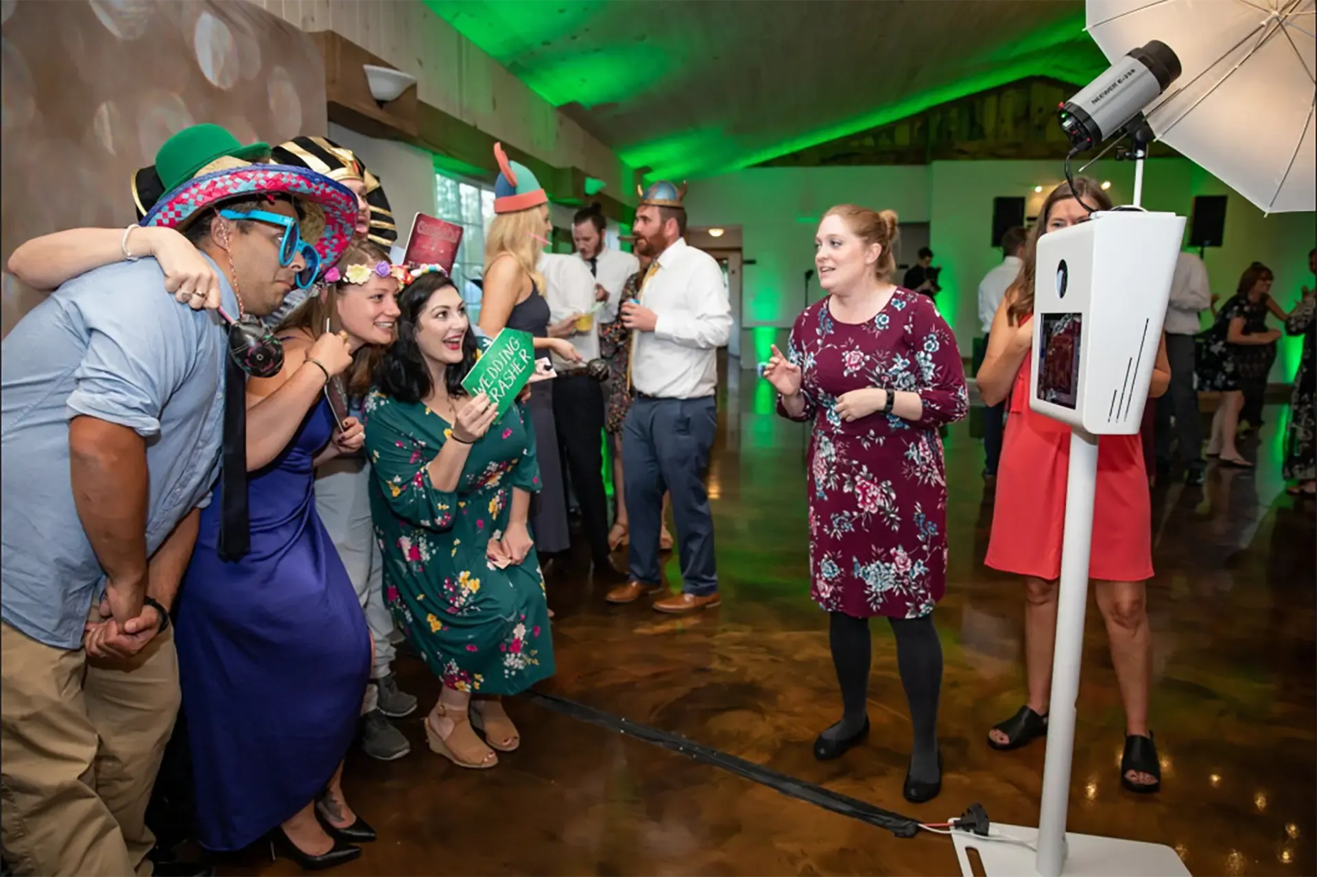 people at a party using a photo booth