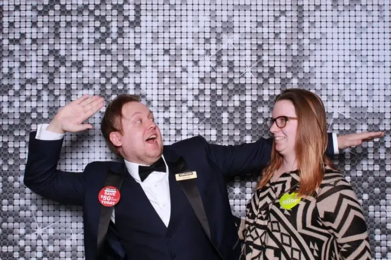 wedding guest in silly poses for a photo booth