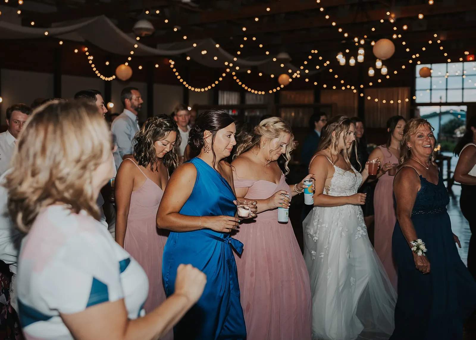 Halle and Brian and guests on the dance floor at their Old Hickory Farm wedding