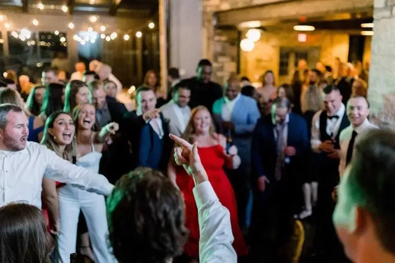 large wedding party dancing at a wedding event