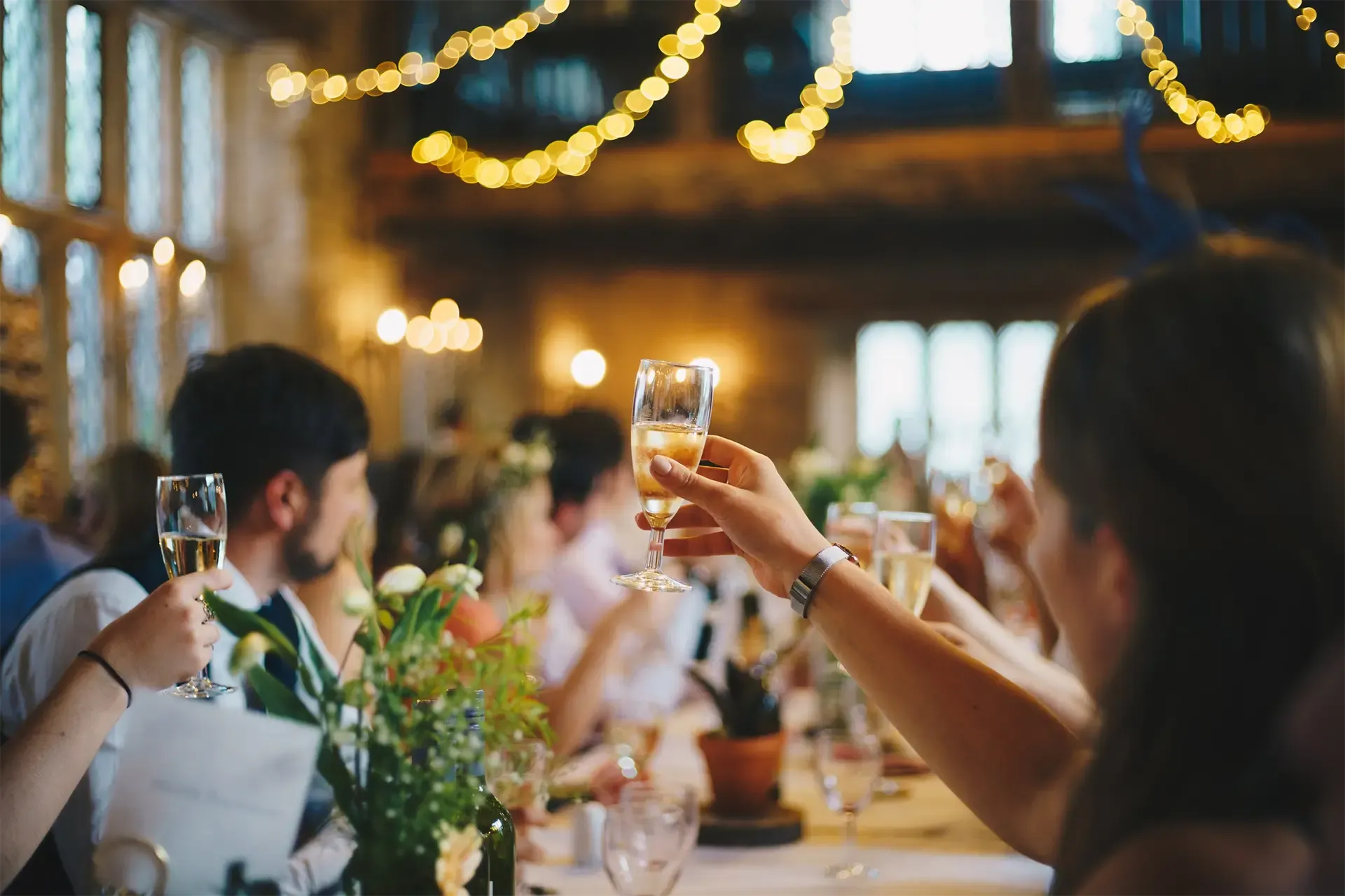 wedding guest toasting to the bride and groom at a wedding event