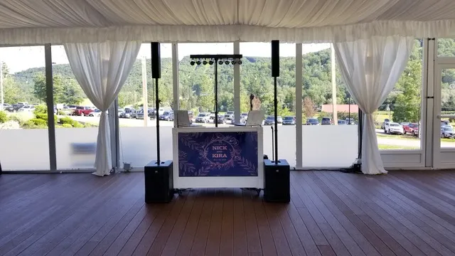Kira and Nick celebrating at their Hope Lake Lodge wedding reception
