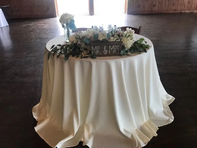 Samantha and Joe at their Old Hickory Farm wedding reception with bistro lighting